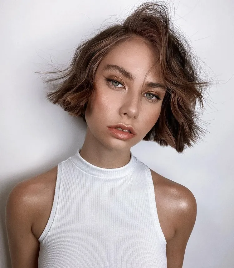 wavy bob with side bangs and blunt ends