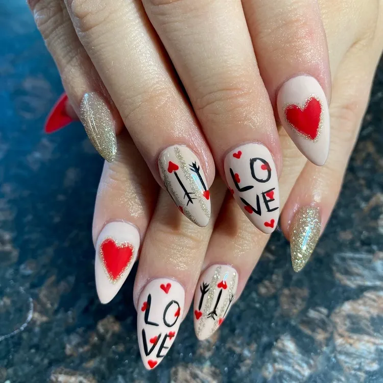 white red and black valentine's day nails with gold glitter and love lettering