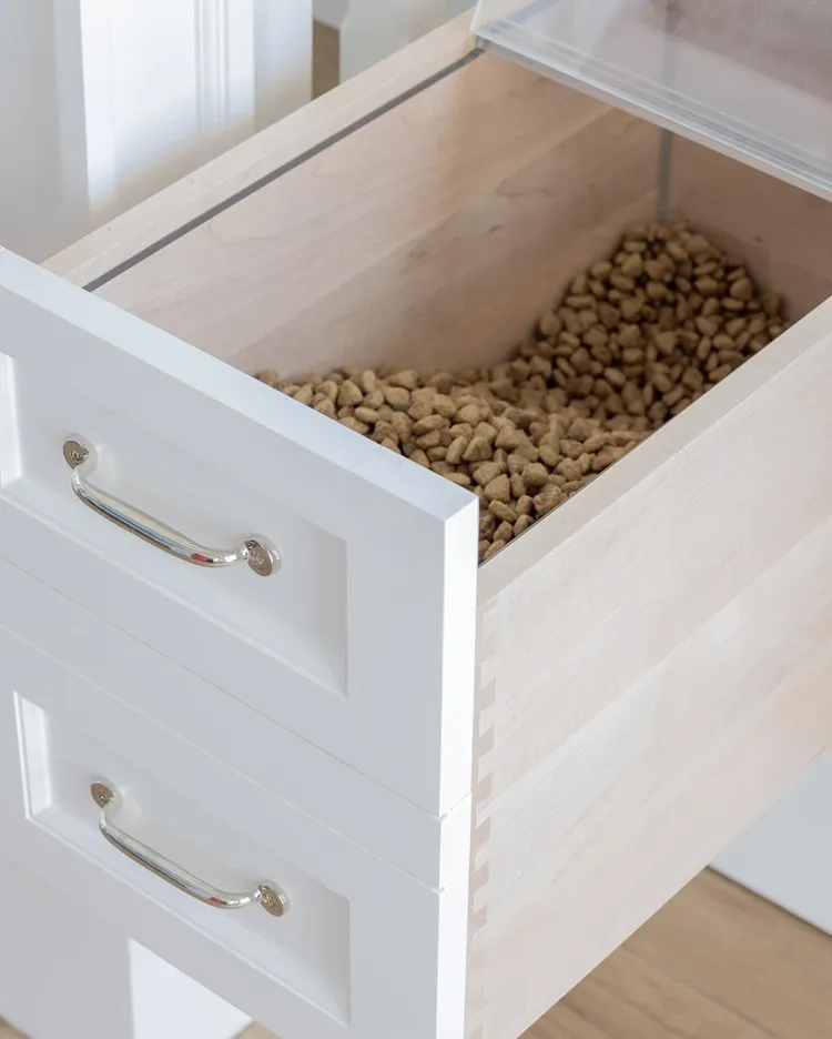 white wood custom dog room idea with hidden food storage
