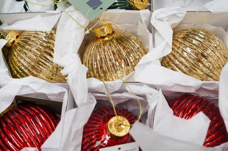 wrapping glass baubles before storing