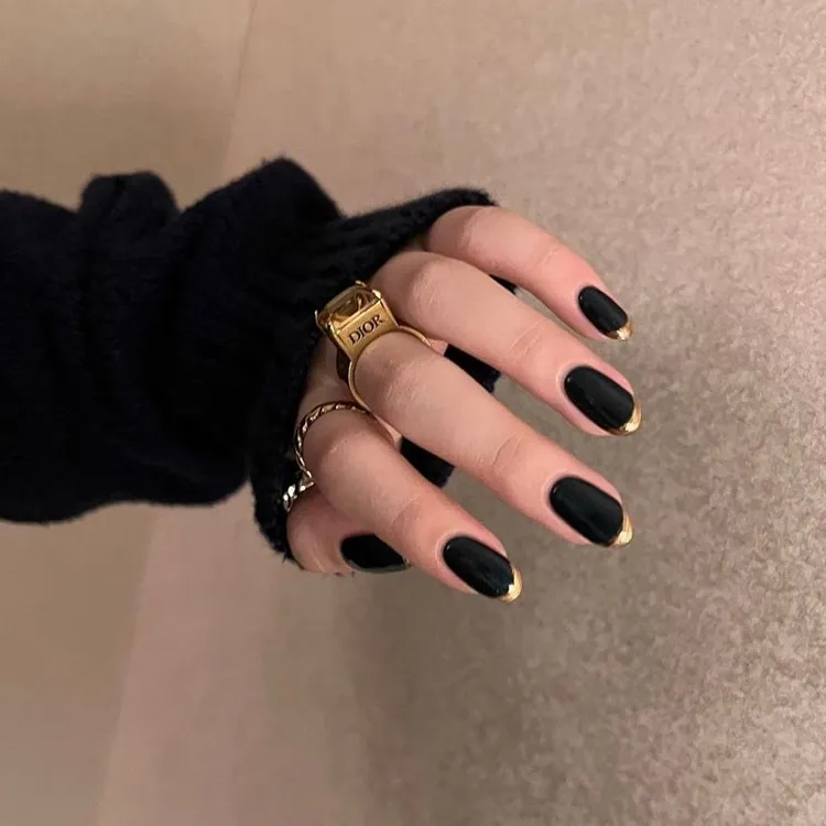 black nails gold metallic french tips elegant spring manicure ideas 2024