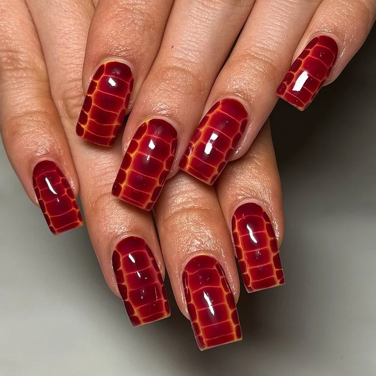 bright red snake print nails