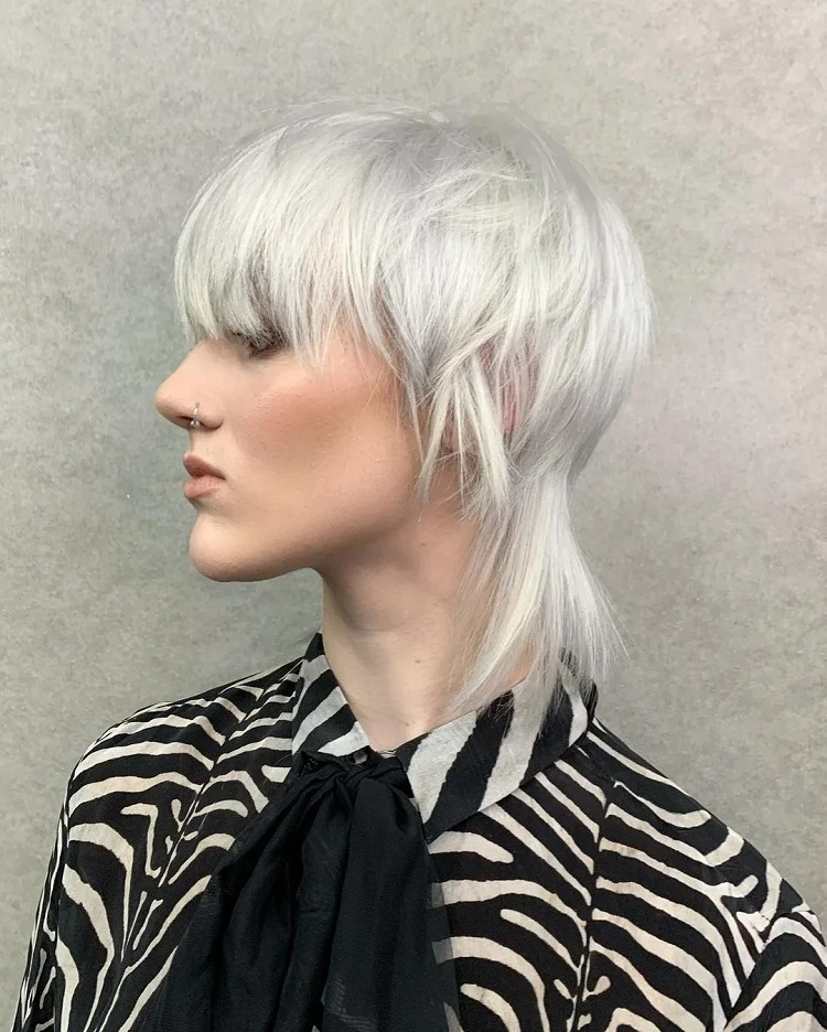edgy white modern mullet with long wispy bangs