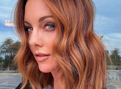 lob haircut 2024 rusty rich auburn hair color woman hairstyle trends