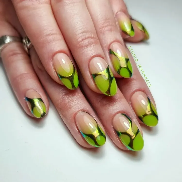 neon green ombre nails with metallic abstract decorations