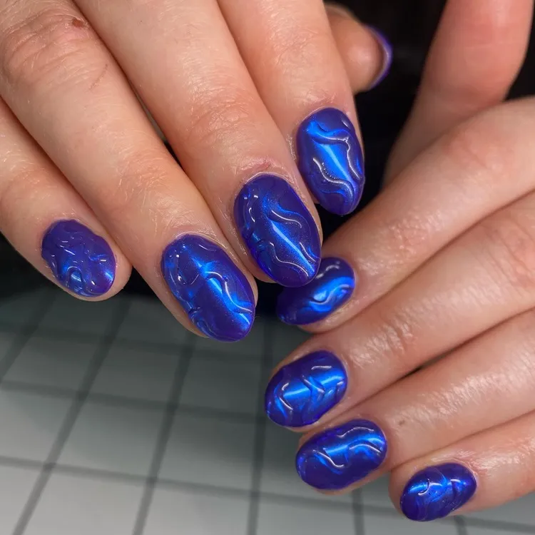 neon midnight blue chrome nails with 3d art