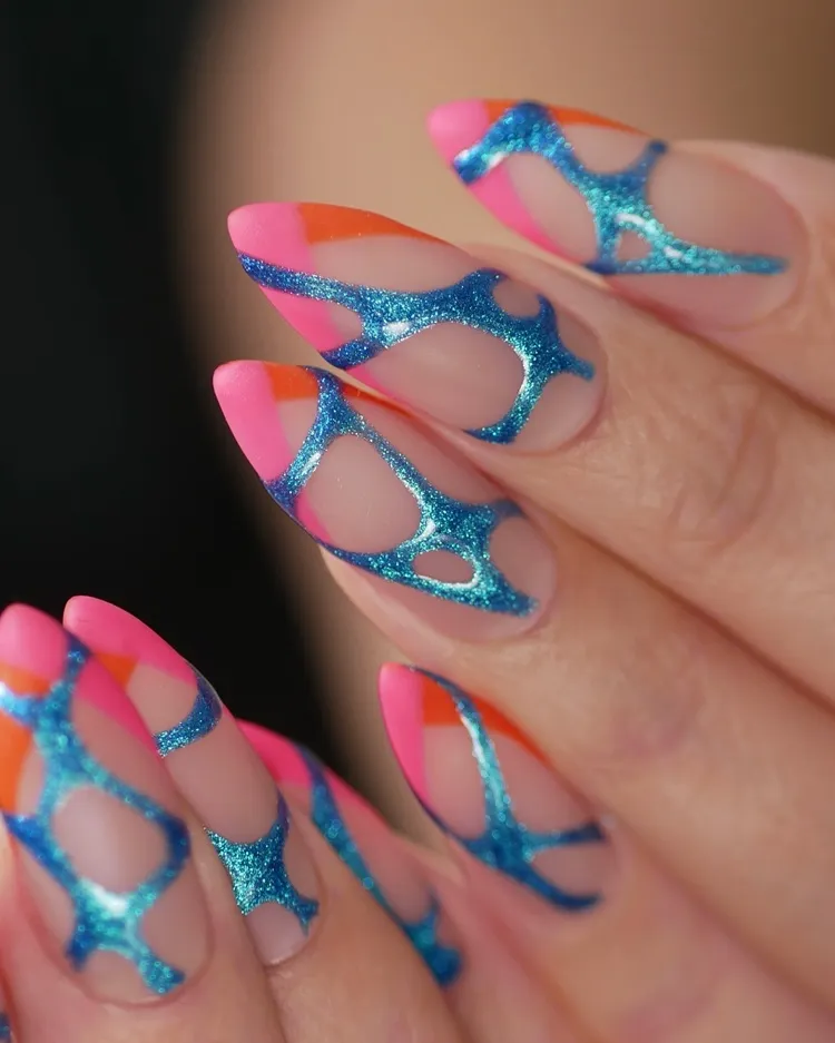 neon pink and orange french tips with blue chrome abstract decorations