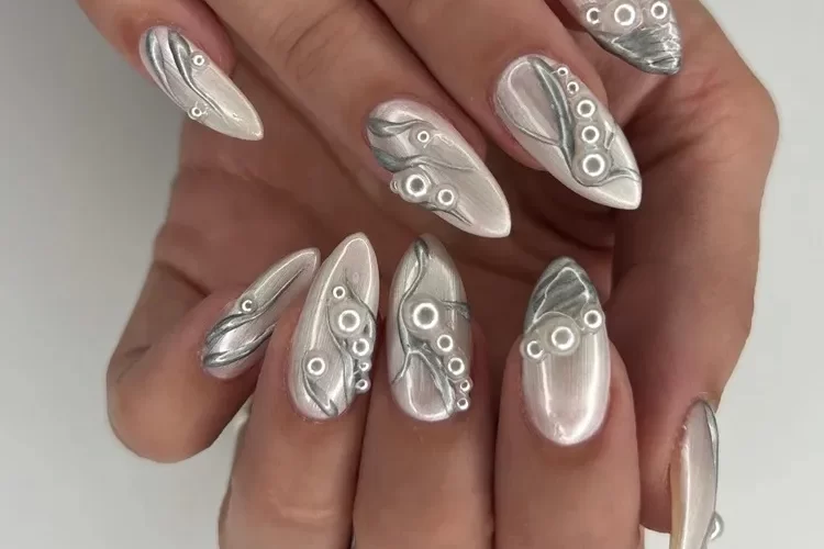 pearly nails with silver metallic decorations and mini pearls