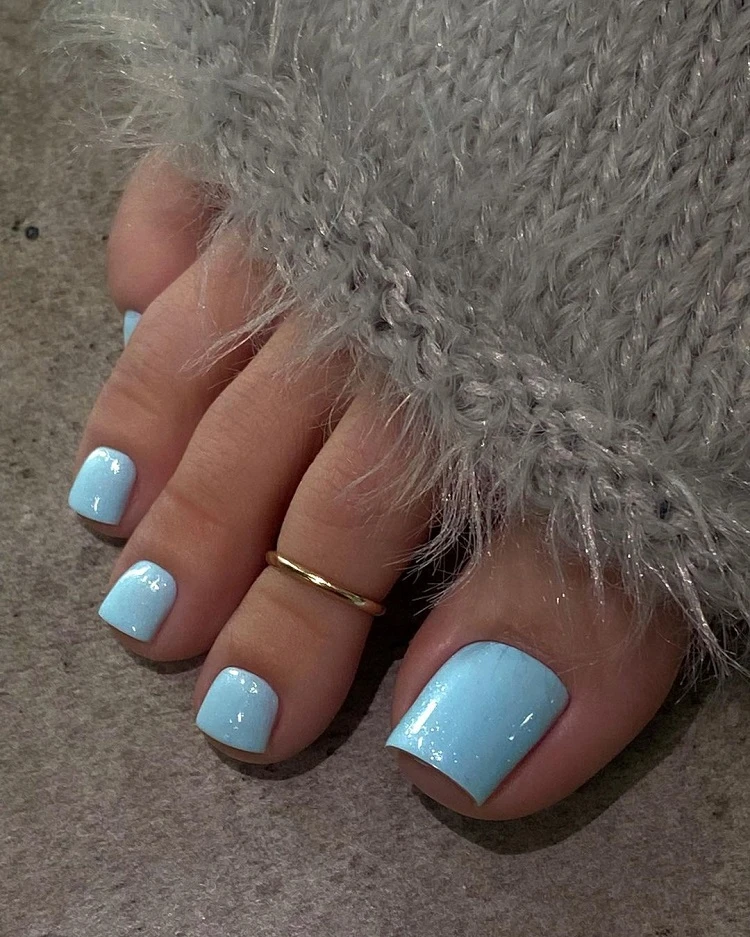 pretty light blue colored toe nails for medium skin tone