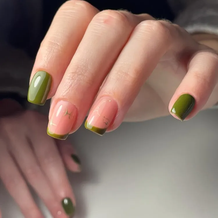 simple olive green french tips with pisces zodiac sign decorations