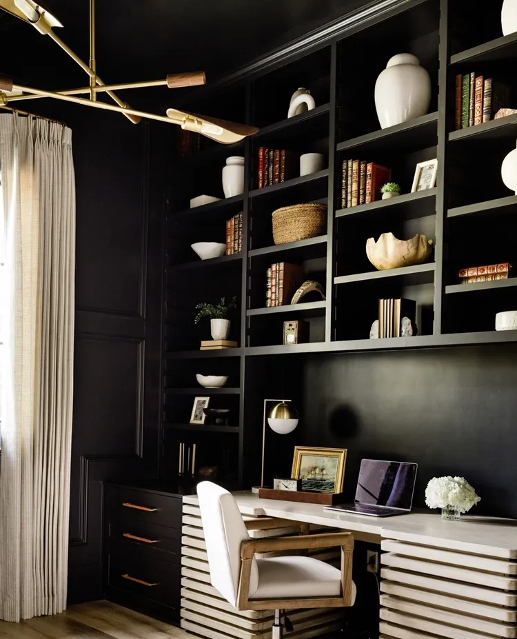 small moody office with a display shelf wall interior design inspo 2024