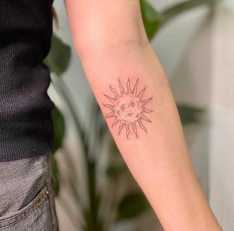 small symbolic sun tattoo for girls
