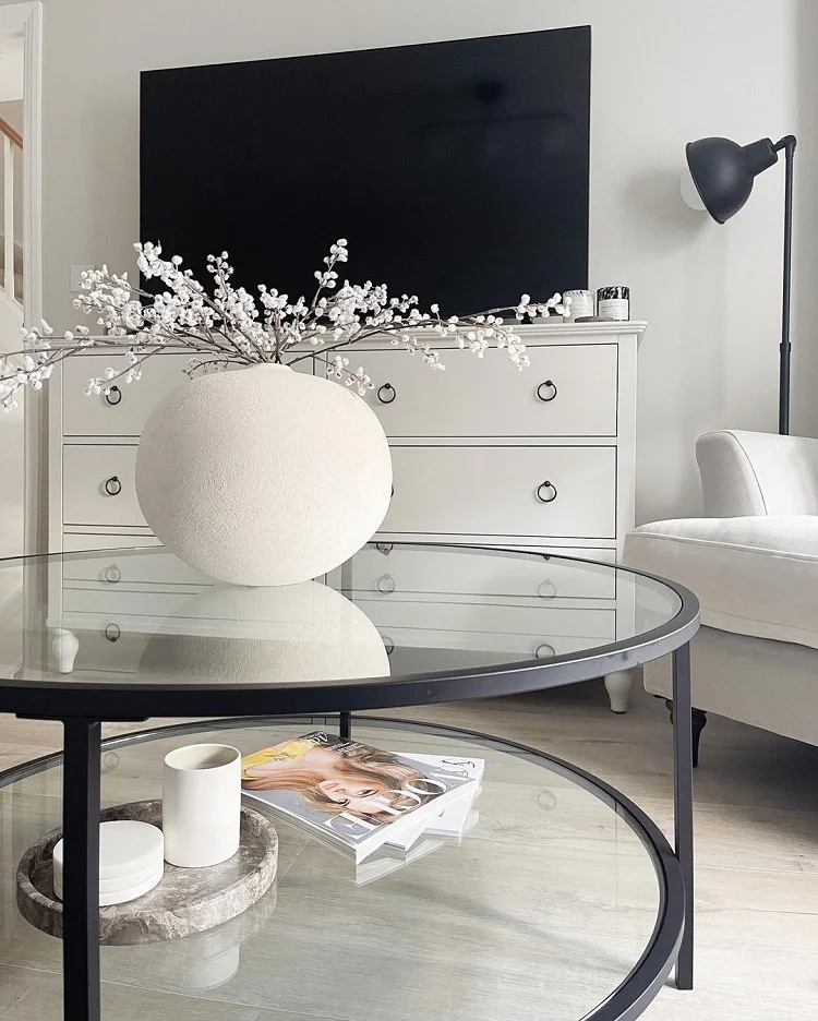 stylish black frame glass coffee table white vase