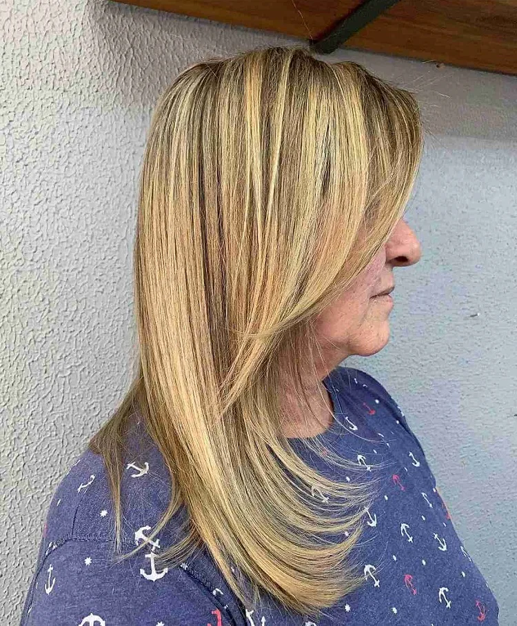 trendy medium to long blonde hair with long side bangs