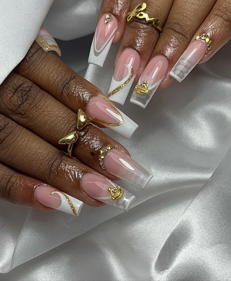 unique white french tips with gold and embellishments mob wife nails idea