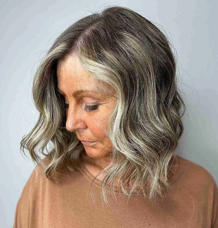 wavy salt and pepper bob with face framing highlights